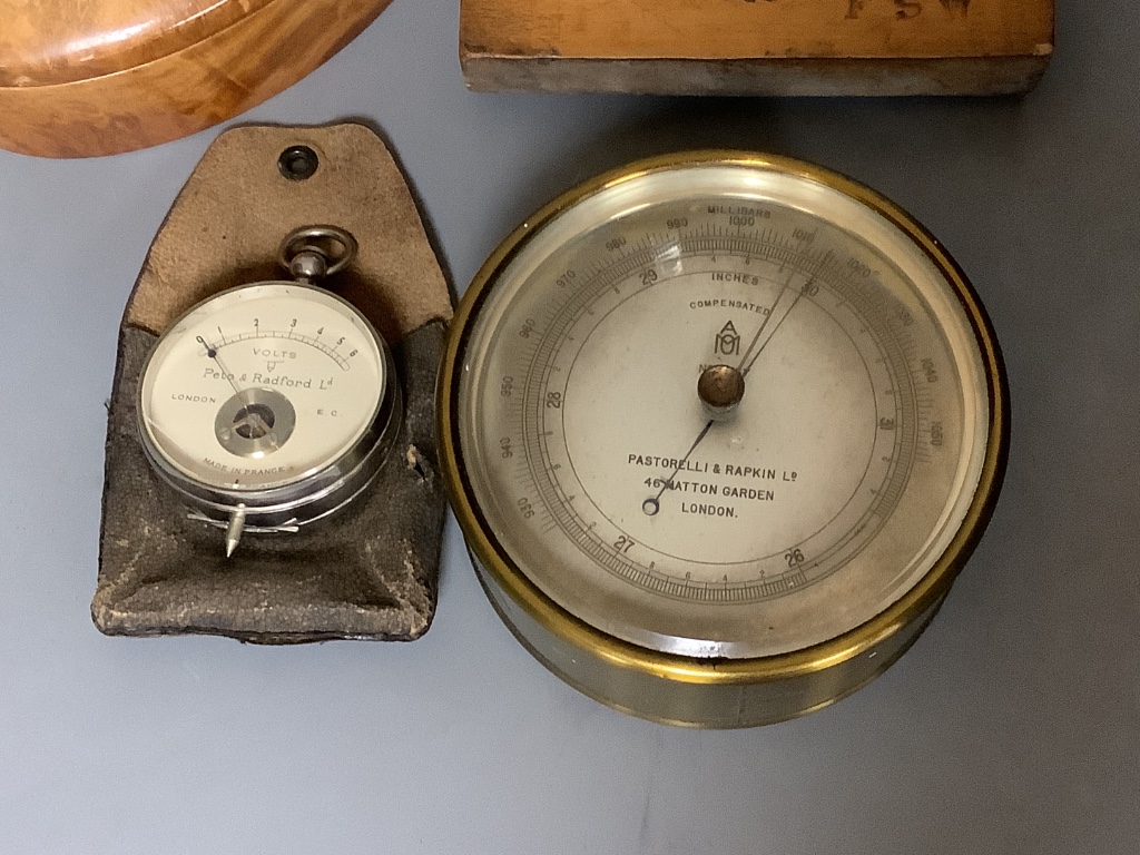 Pastorelli & Rapkin compensated barometer, model number 6557, a Peto & Radford voltometer, treen mould and an amboyna box